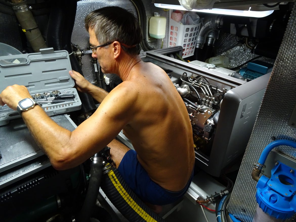 Glen tackles the generator to remove the heat exchanger Glen tackles the generator to remove the heat exchanger