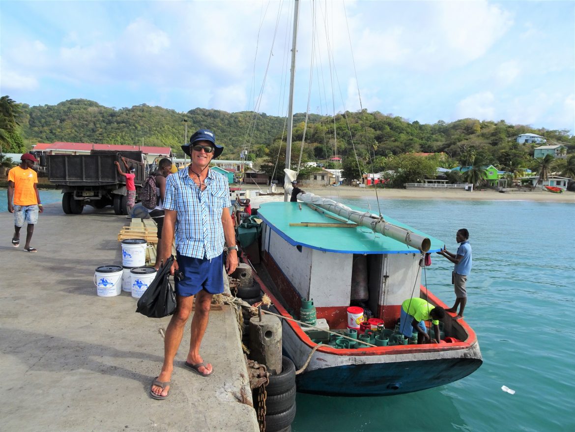 Hillsborough jetty with local boats loading by hand