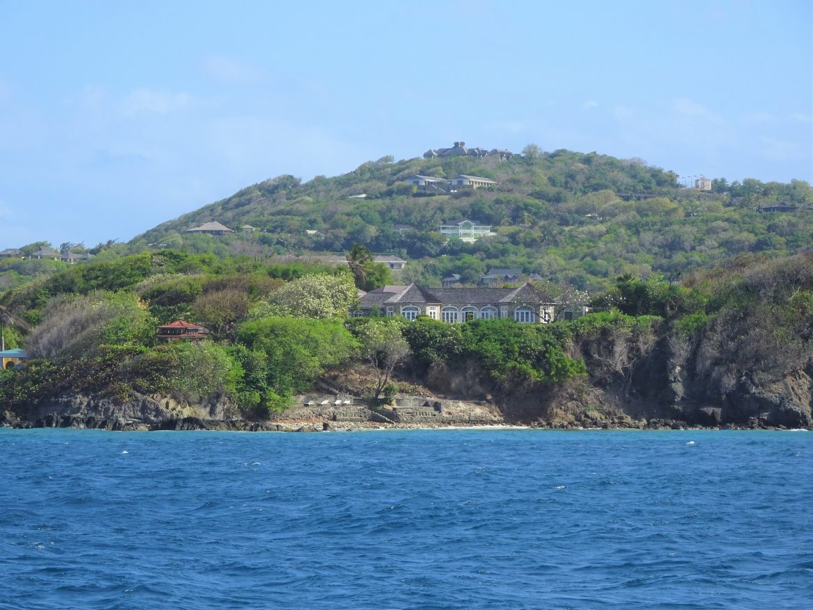 Impressive villas on the hills, as we arrive in Mustique