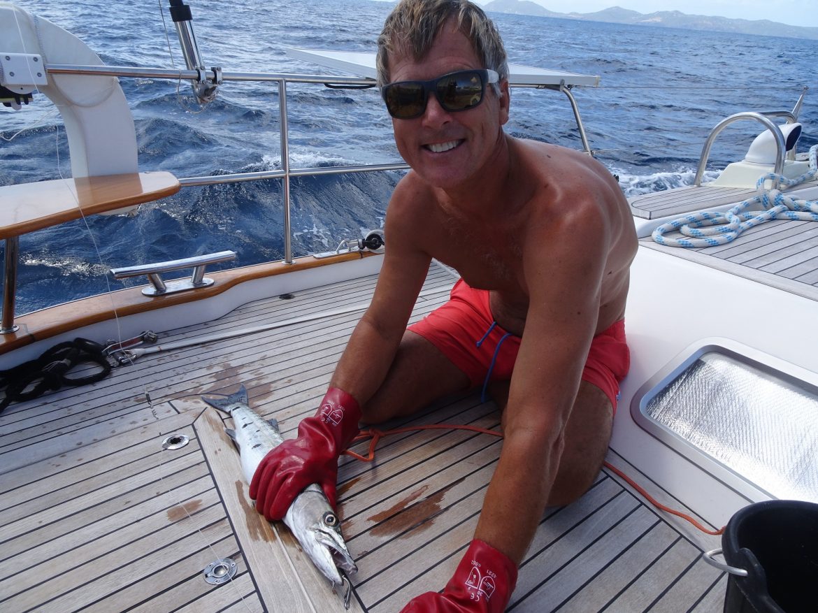 Glen is fishing a barracuda as we are departing Mustique