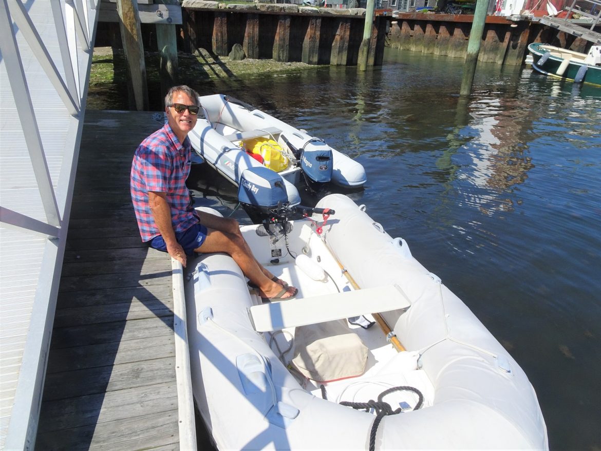 Twin outboard covers on the dinghy dock - at Bristol Marine in Bristol Rhode Island