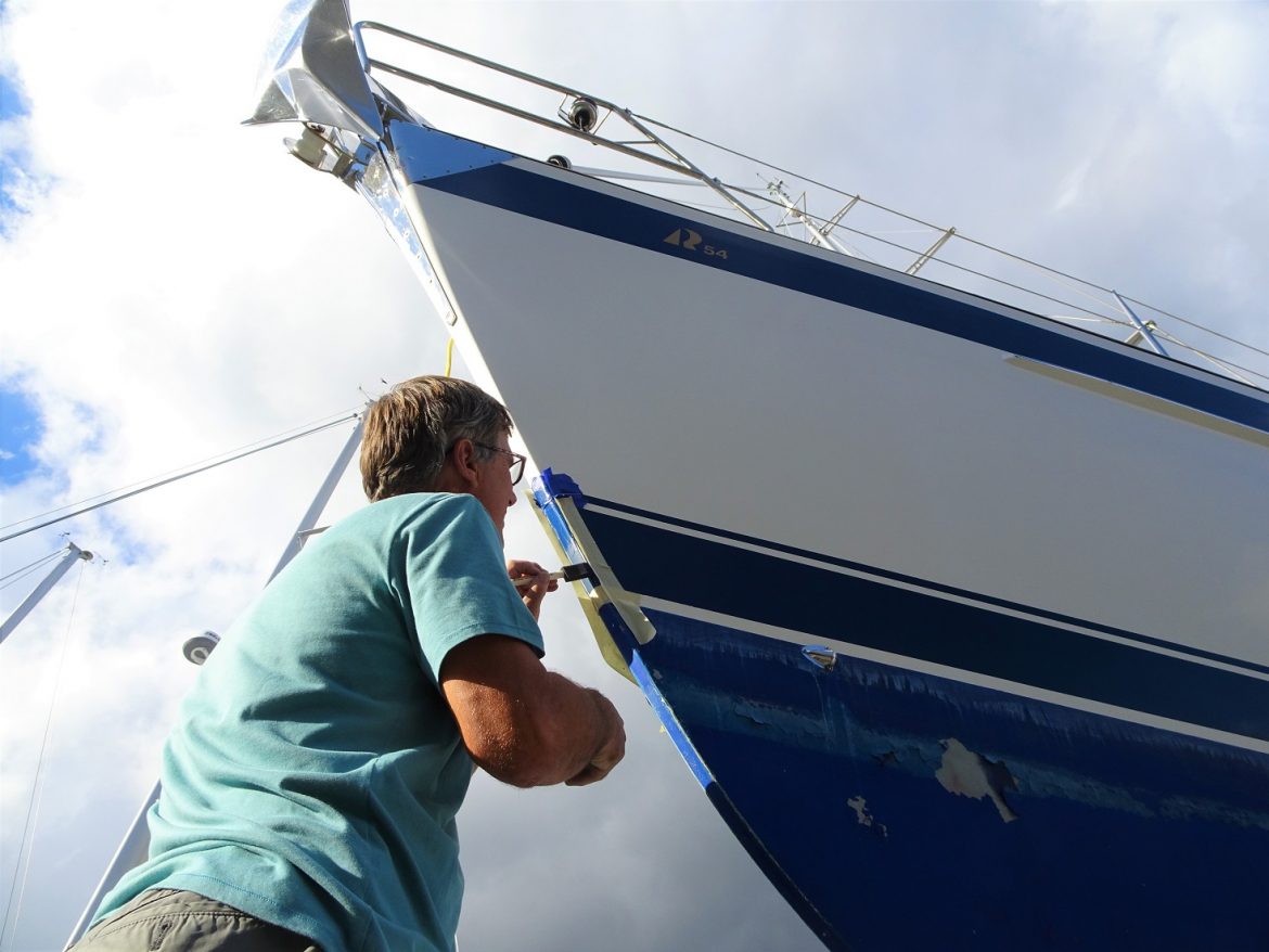 Glen paints the bow blue stripe Glen paints the bow blue stripe