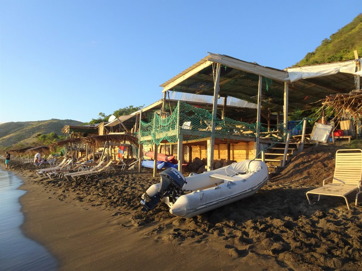 Dinghy beached in front of Shipwreck