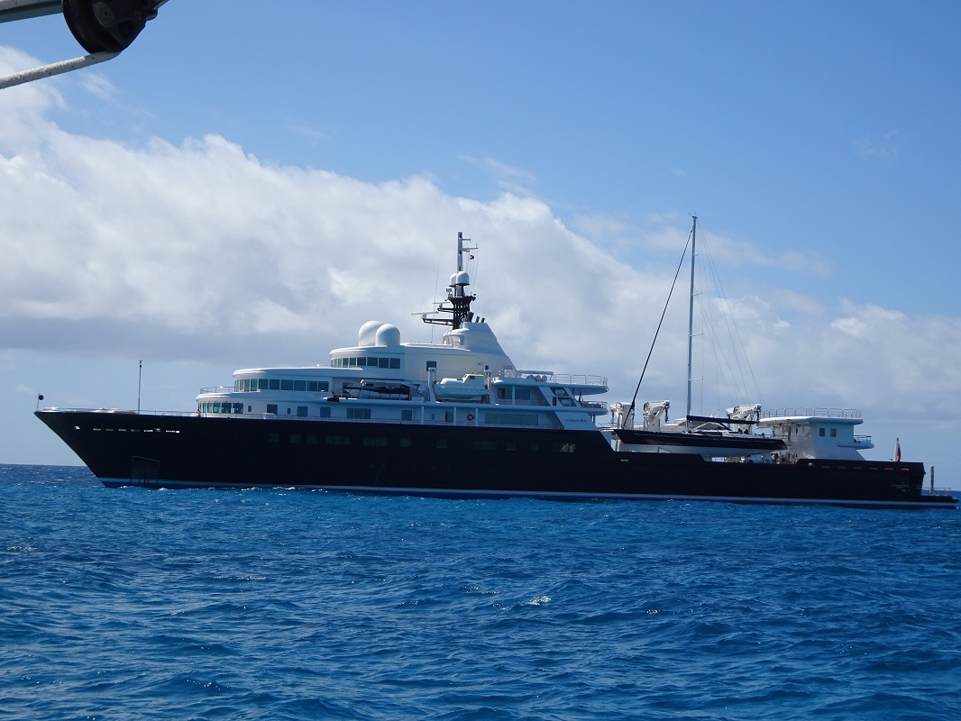 A superyacht with a sailing yacht as a toy A superyacht with a sailing yacht as a toy