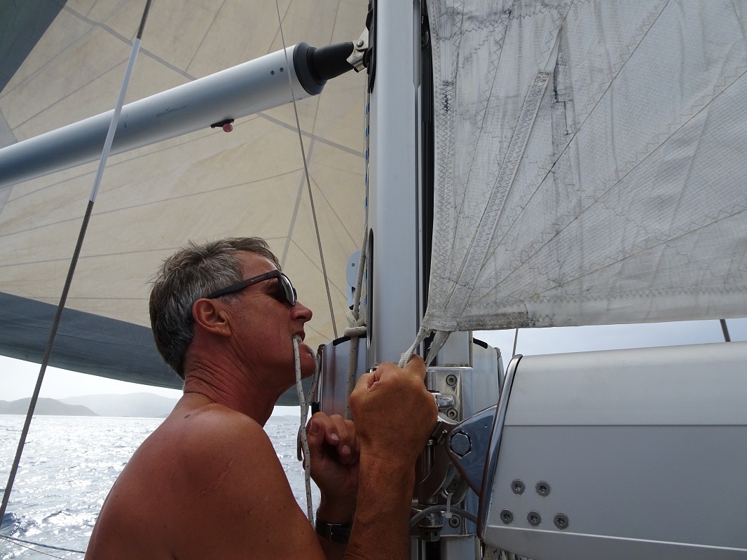 Glen trying to hook the tack loop back inside the mast