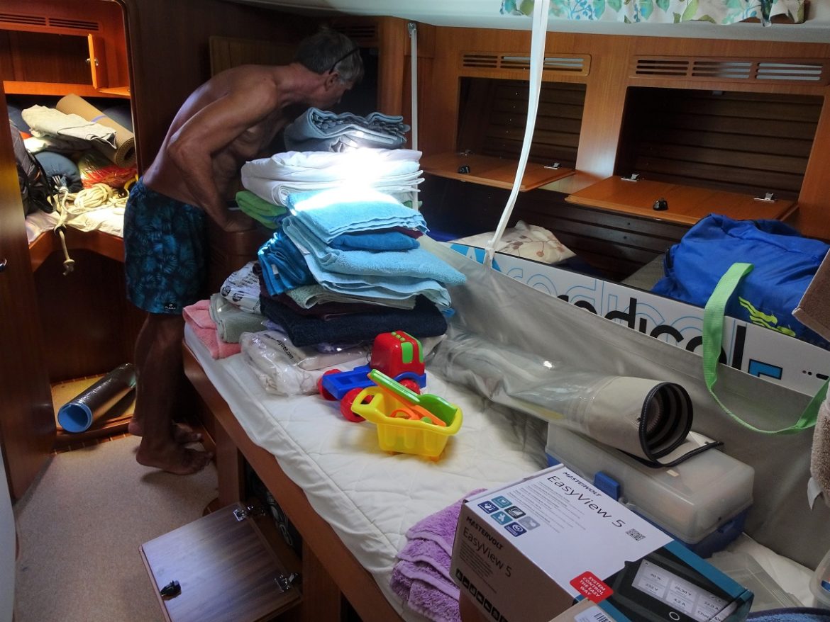Cleaning the cupboards in mid-cabin