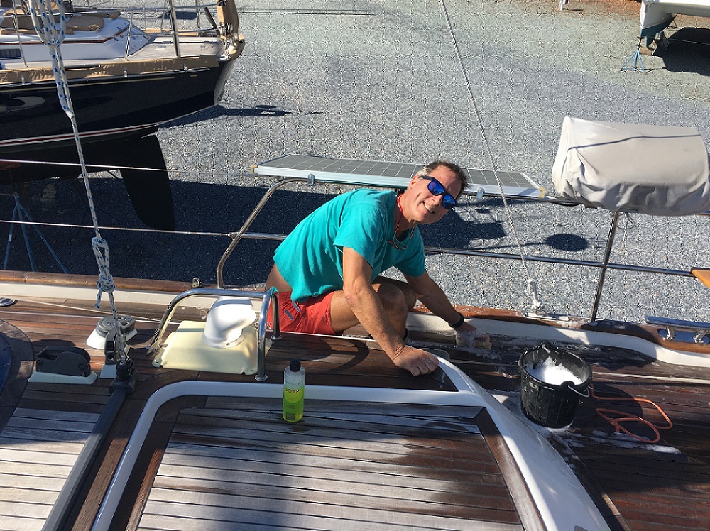 Glen washes the decks of Cloudy Bay