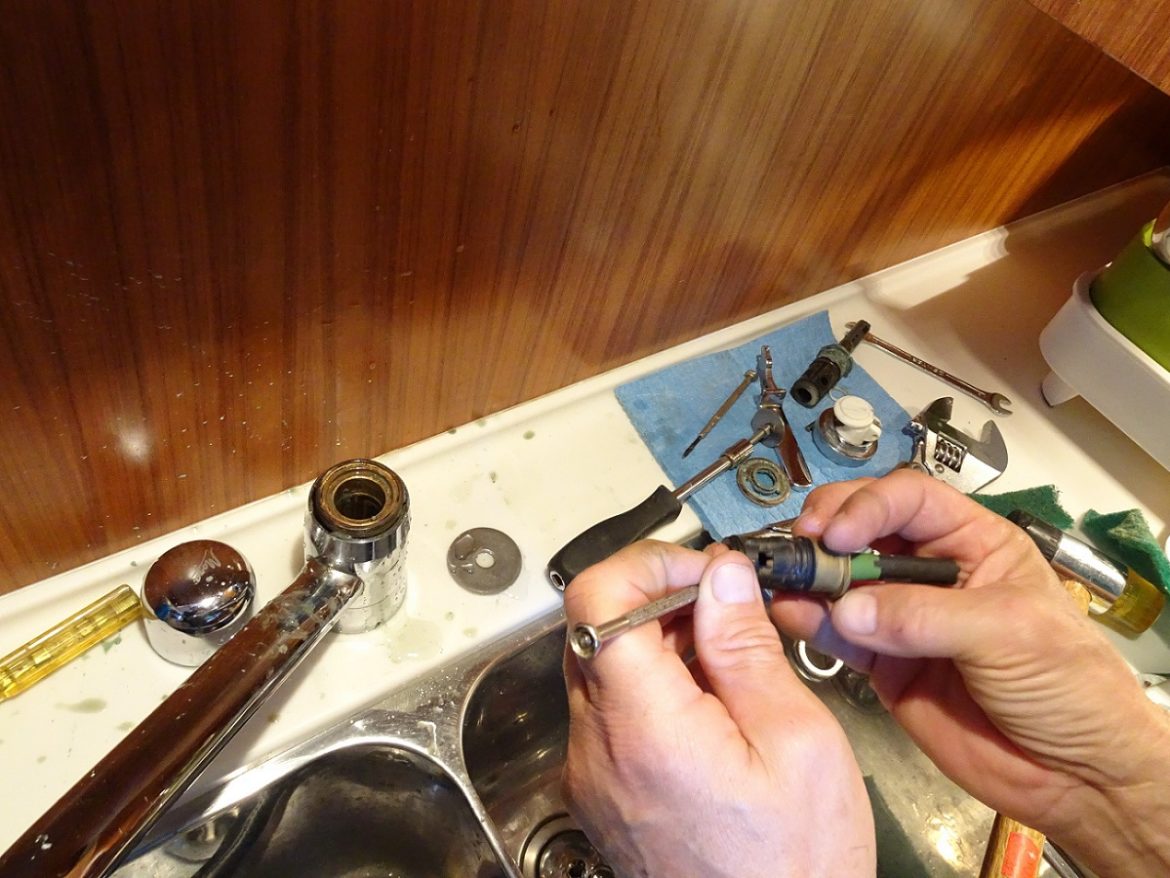 Cleaning the leaking galley faucet, s/v Cloudy Bay