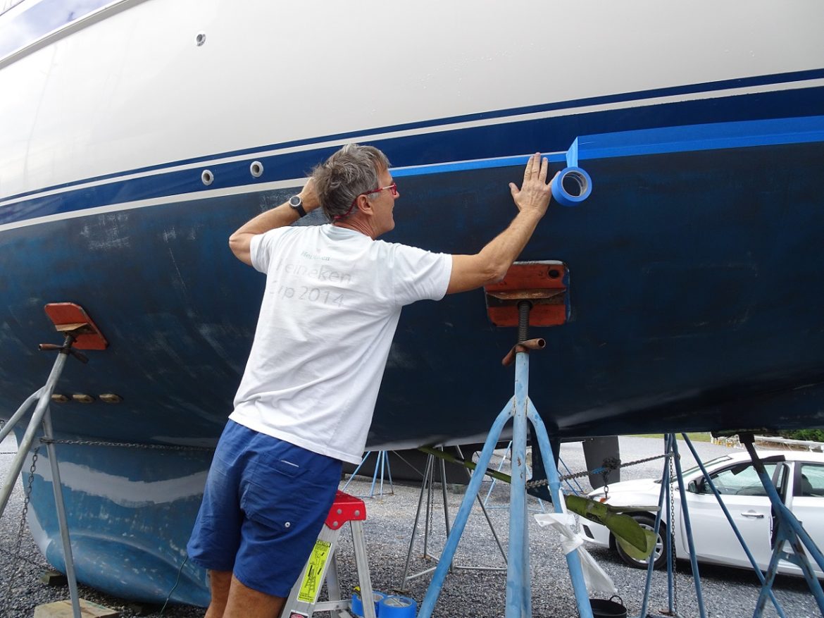 Masking off ready for antifouling paint – s/v Cloudy Bay Masking off ready for antifouling paint - s/v Cloudy Bay