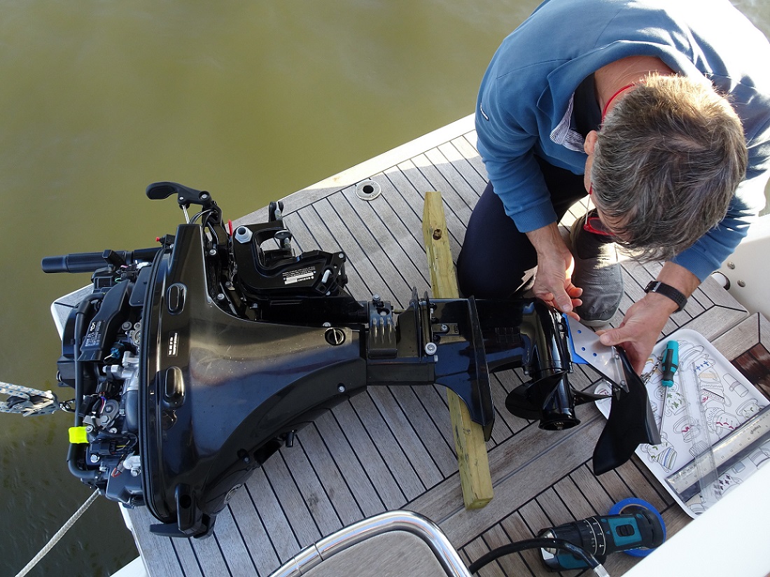 Glen installs new hydro-shield on the outboard Glen installs new hydro-shield on the outboard