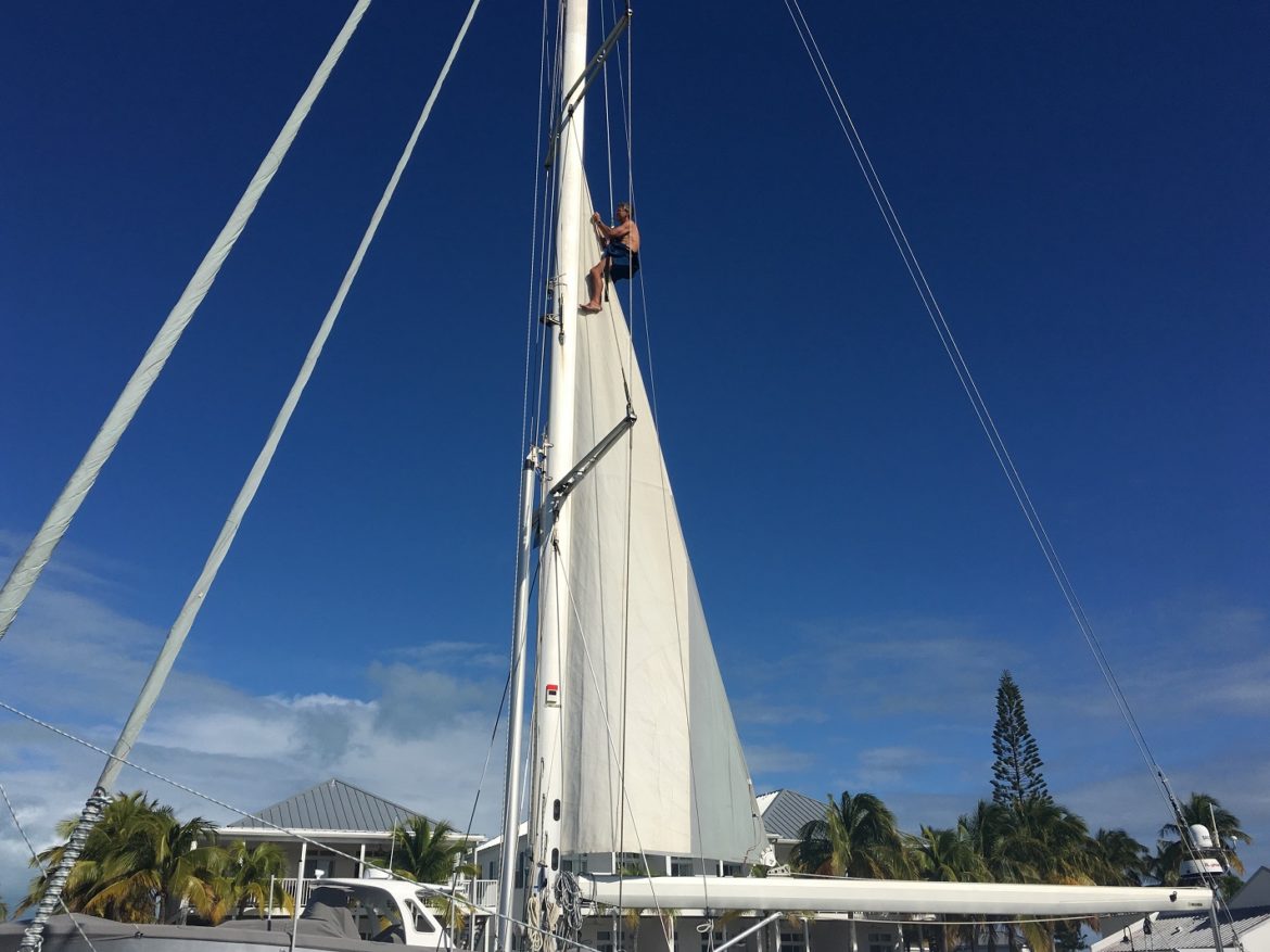 Stitching the main sail, Cape Eleuthera Marina Stitching the main sail, Cape Eleuthera Marina
