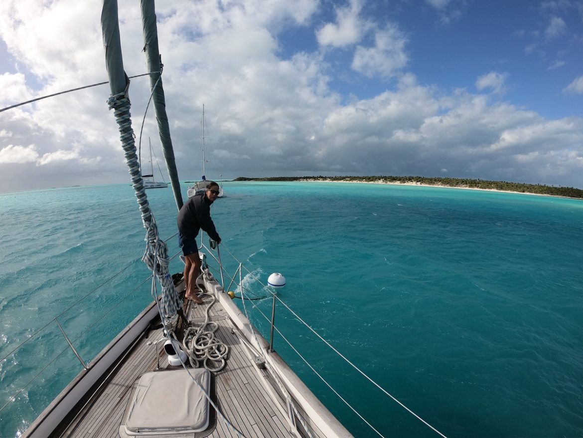 Fighting to keepthe mooring buoyoff the bow, Warderick Wells Cay Bahamas Fighting to keepthe mooring buoyoff the bow, Warderick Wells Cay Bahamas
