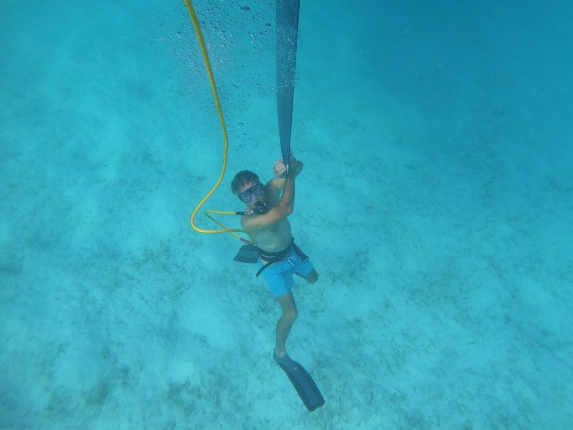 Hookah diving to epoxy tip of the rudder