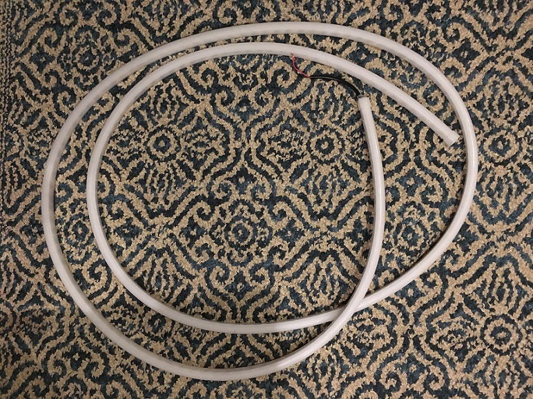 LED strip fed through rubber strip LED strip fed through rubber strip